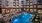 a swimming pool in front of a building