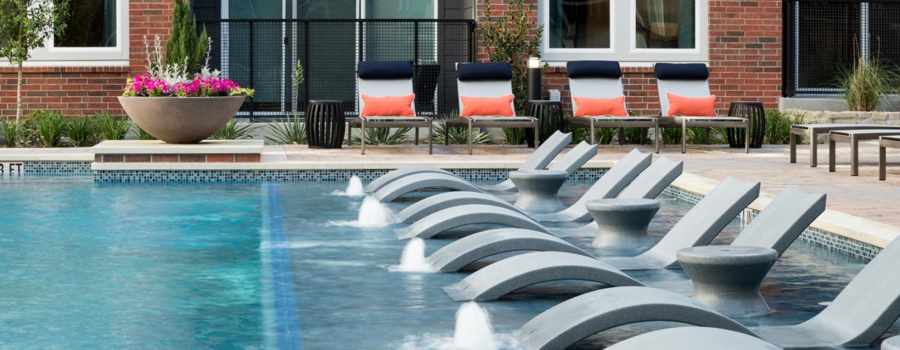 a pool with chairs around it