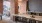a kitchen with a brick wall