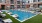 a pool with chairs around it